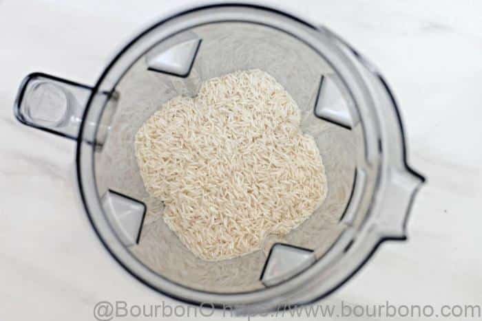 Pour the rice into the blender and add water while grinding