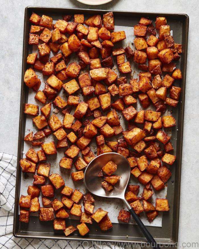 The secret about how to cook frozen diced potatoes in the oven is to form the potatoes in a single layer